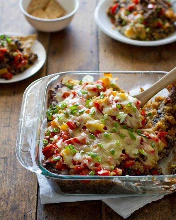 Quinoa and black bean casserole in a clear baking dish.