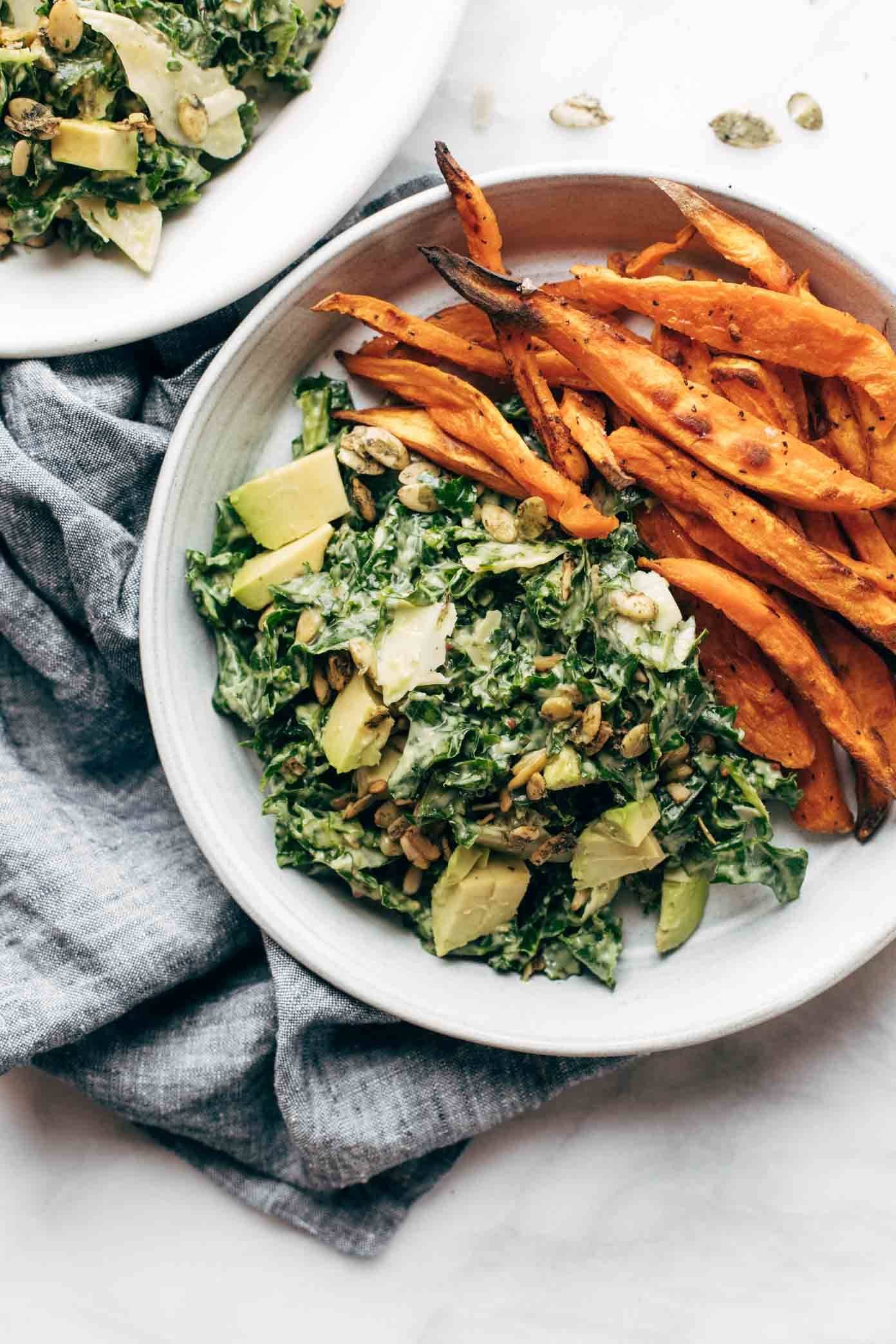 Kale salad with sweet potato fries.