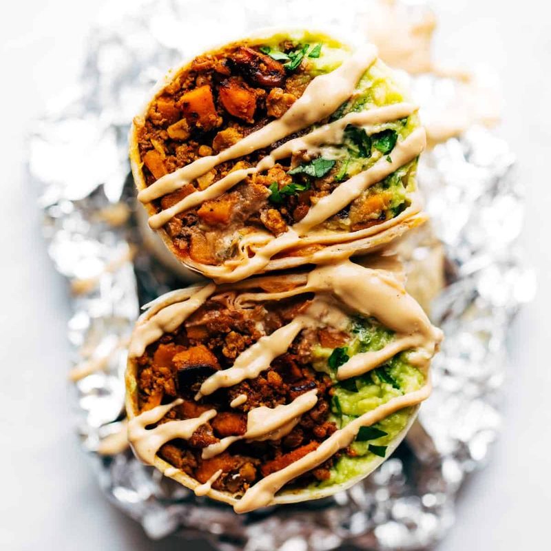 Vegan mega-burrito with vegan queso.